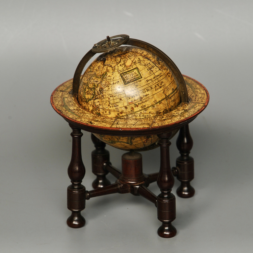Rare example of a pocket globe in original table stand